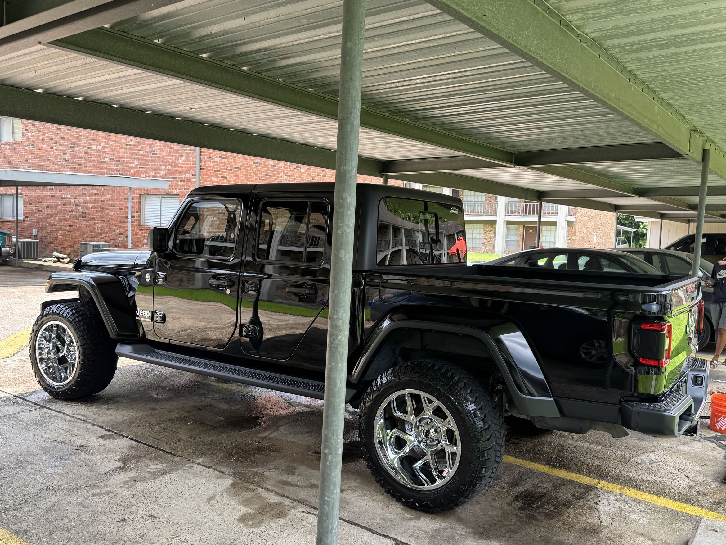 Black Jeep Gladiator side profile after detailing