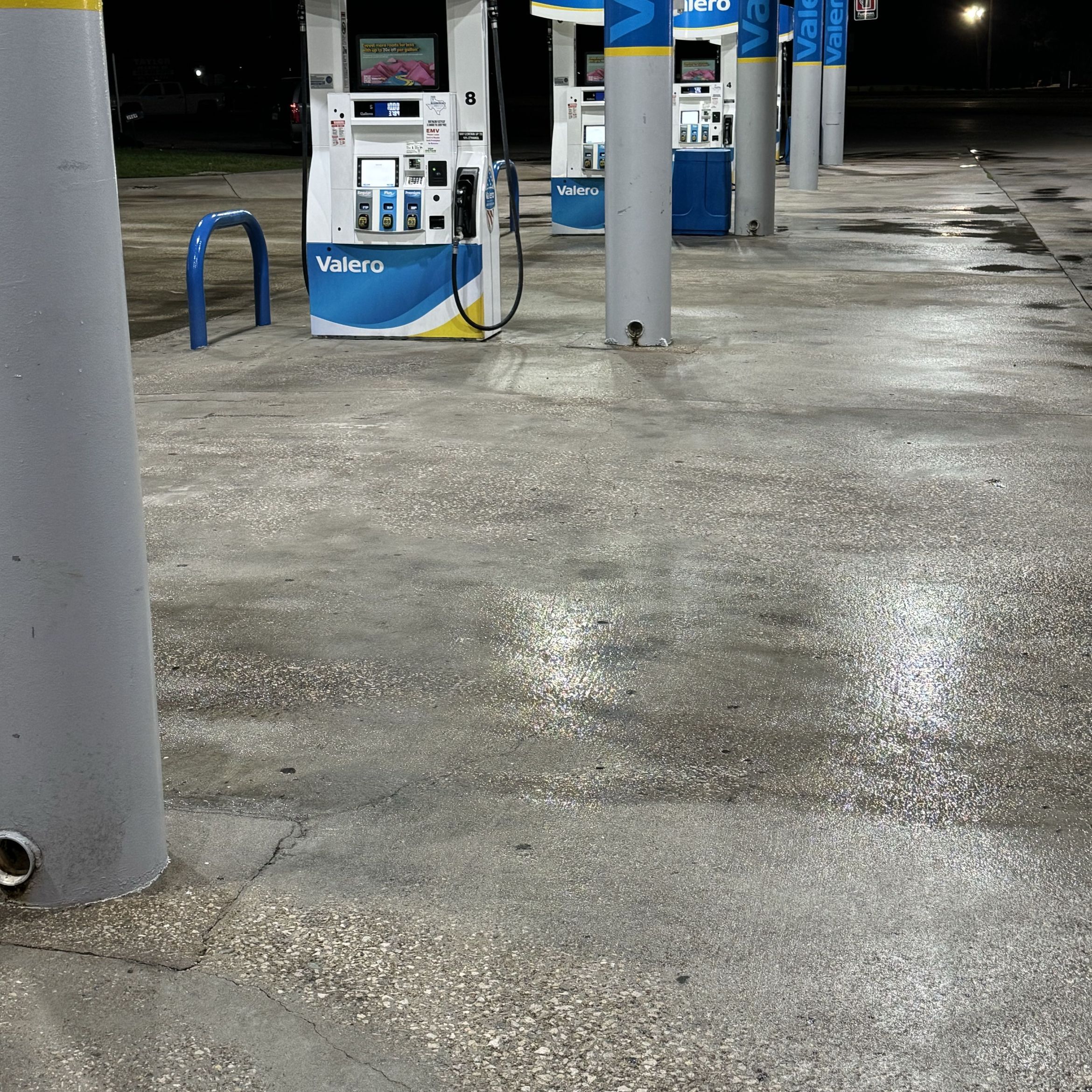 Pressure-washed concrete forecourt at a Beaumont gas station
