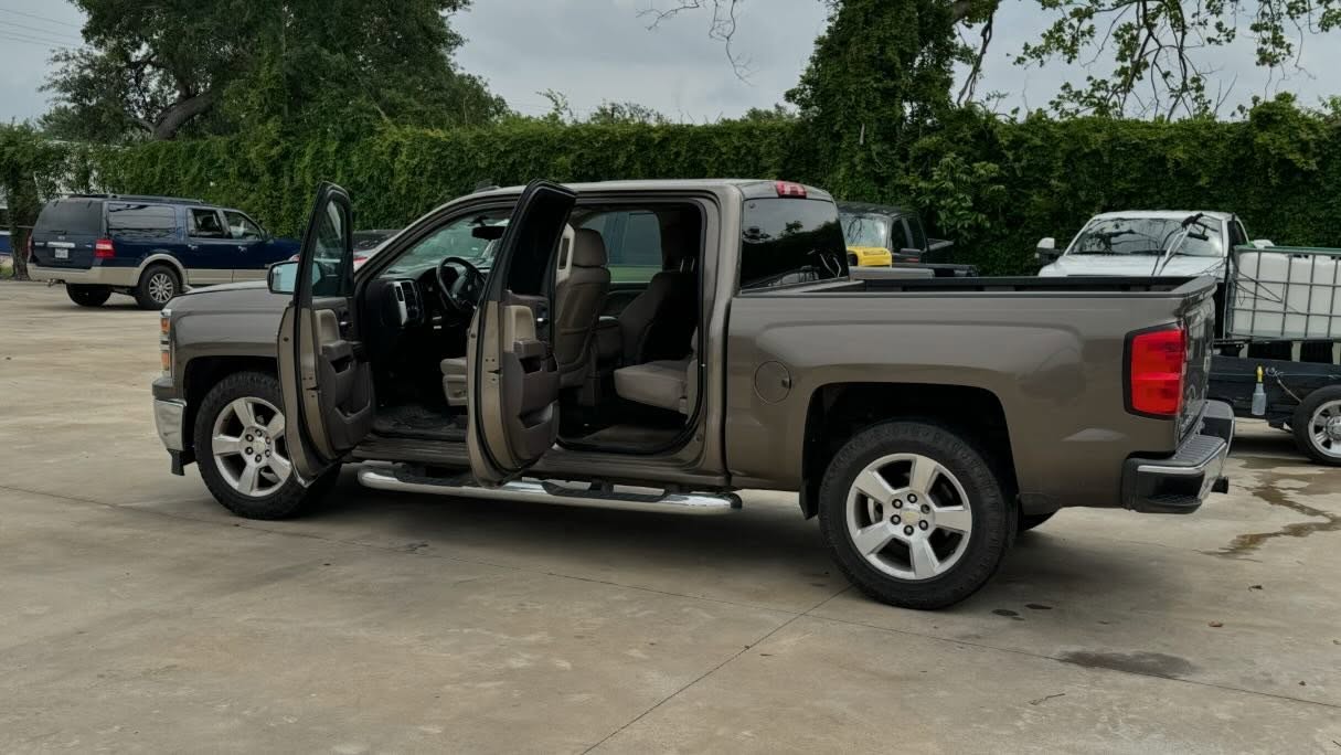 Silverado side profile with doors open after hand wash and wax